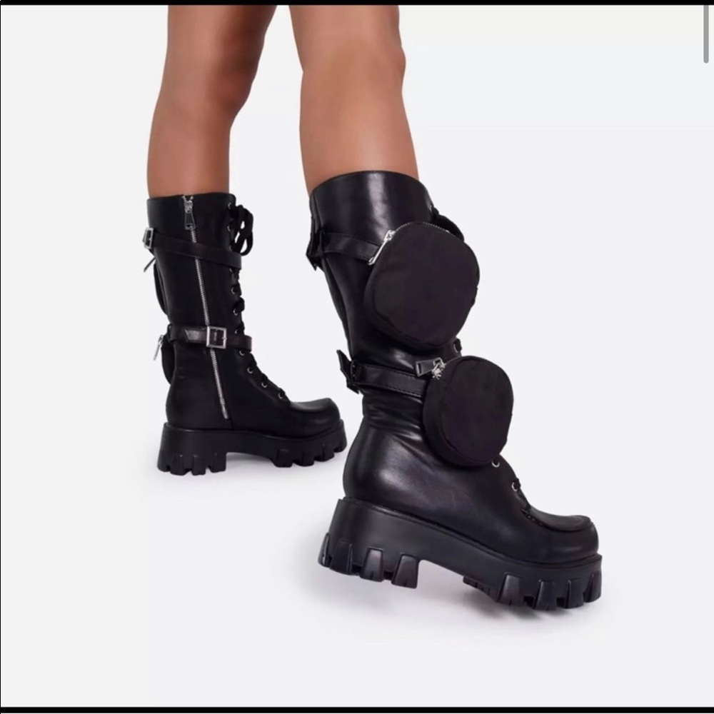 Black combat boots with pouches